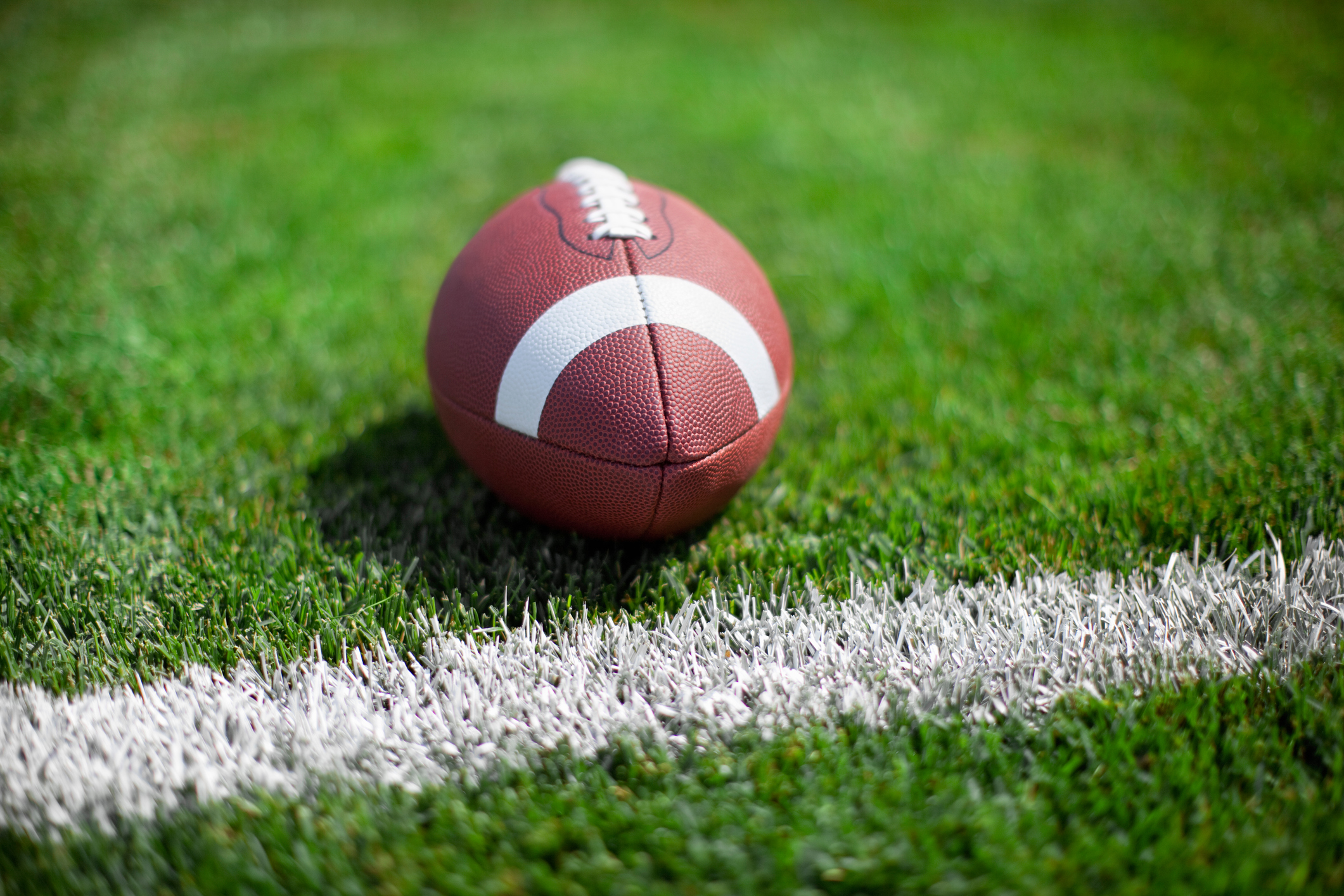 Close-Up Of American Football Ball At The Edge
