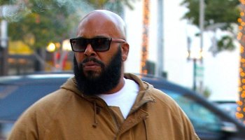 Hip-Hop Producer Suge Knight sighted smoking a cigar walking on Wilshire Boulevard