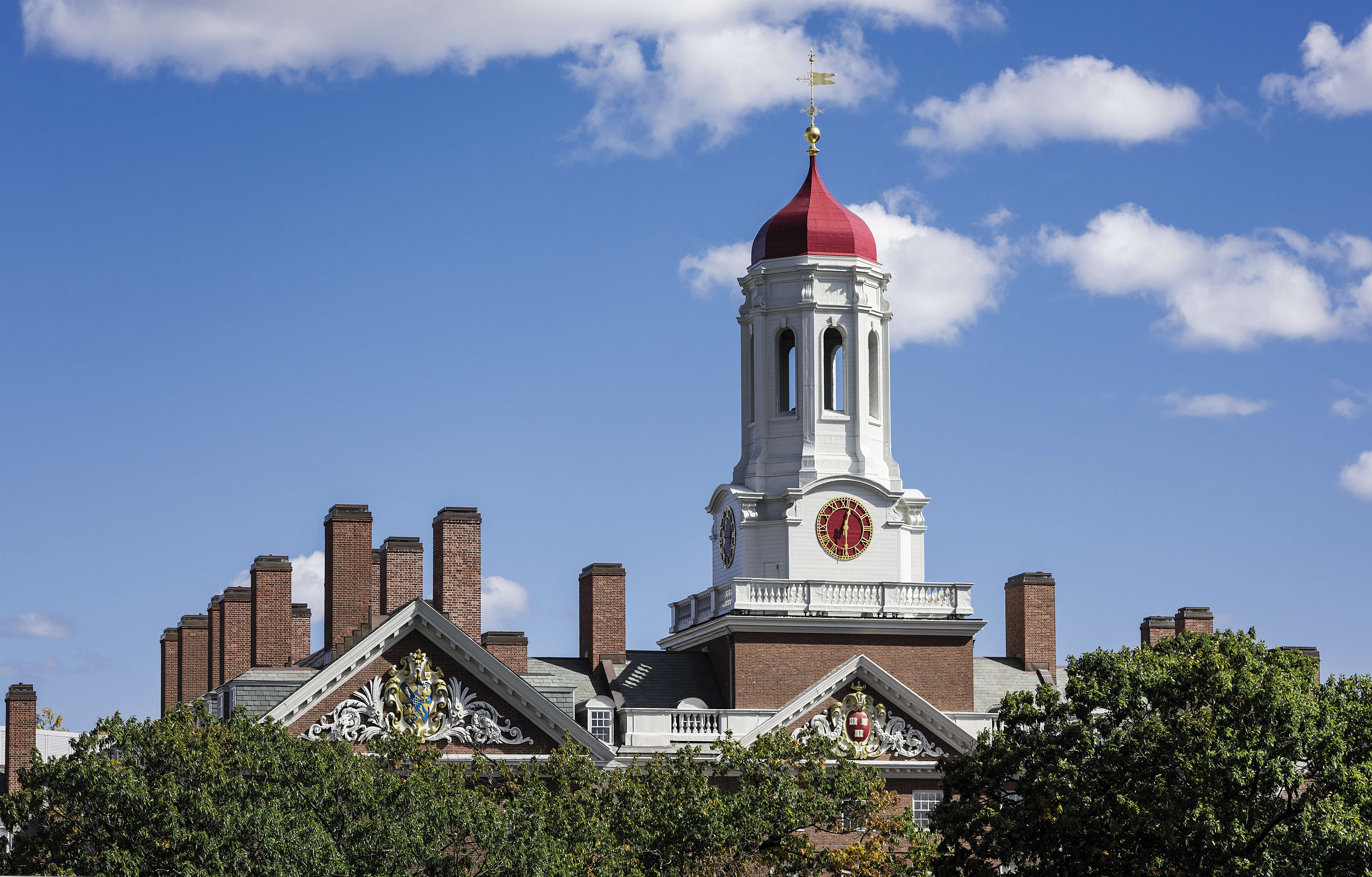 Dunster House dormitory with clock tower, Harvard University...