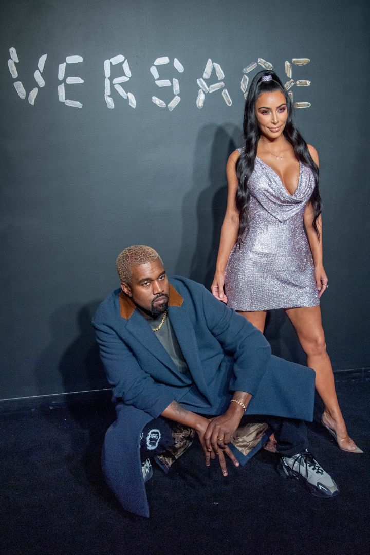 'Ye gets in his bag for the photogs.