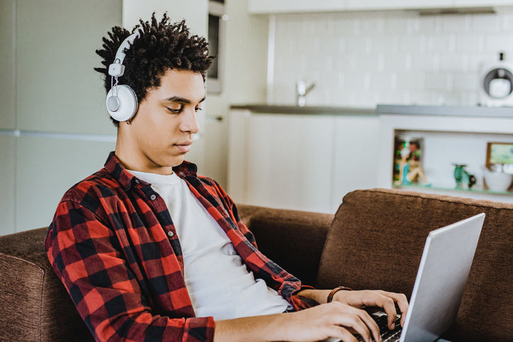 Man using laptop at home