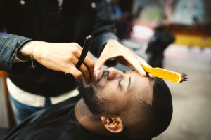 Man shaving in barber shop