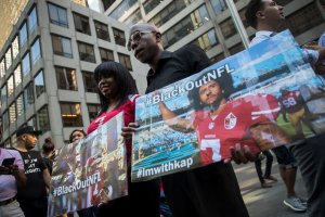 Rally In Support Of NFL Quarterback Colin Kaepernick Outside The League's HQ In New York