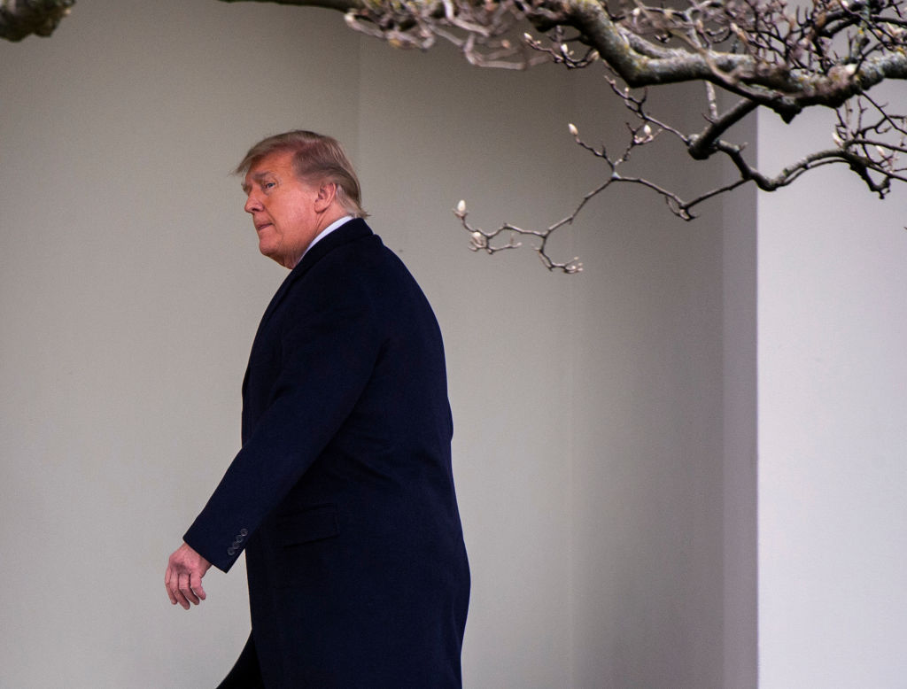 The President and First Lady arrive on the South Lawn of the White House after returning from Florida, on December 31 in Washington, DC.