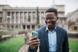 Young African American businessman using a smart phone