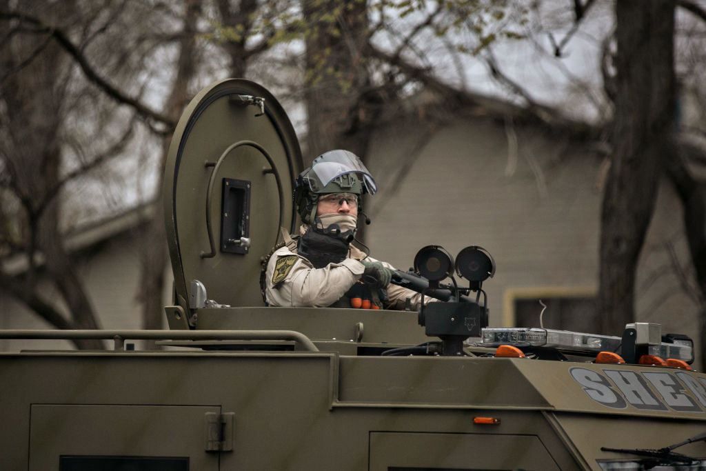 Protesters gather outside the Brooklyn Center Police Department calling for justice for Daunte Wright