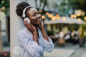 Woman with headphones on the street