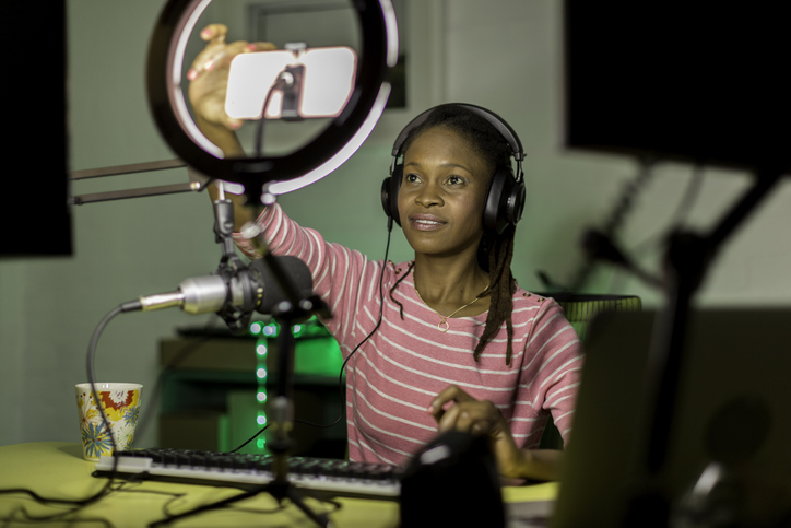 Young black woman recording a business podcast