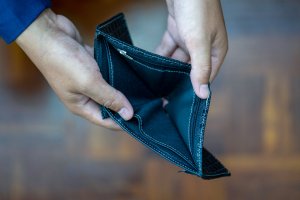 Close up man hand opening empty wallet.