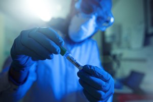 Researcher at work in laboratory: vaccine for coronavirus and Covid