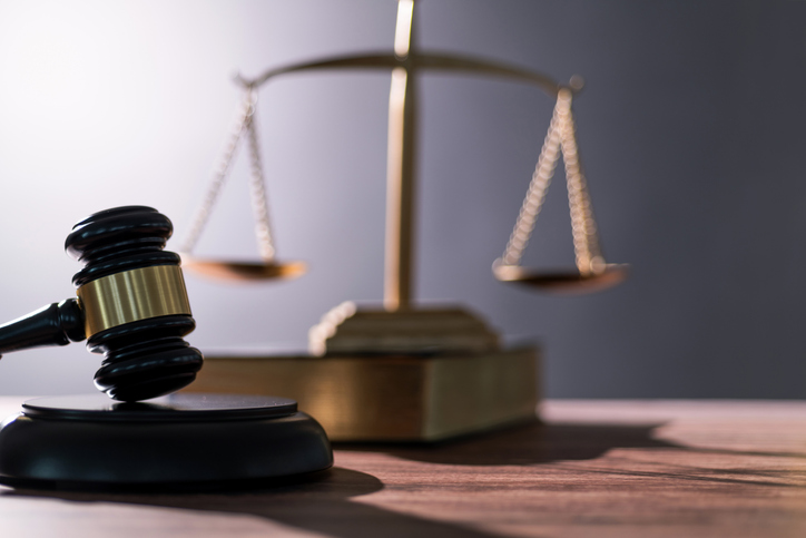 Gavel and scales of justice on the table