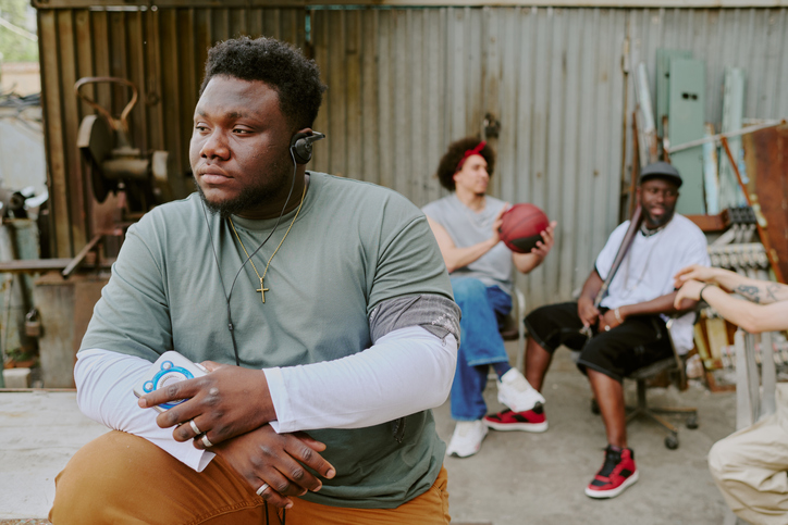 Man Listening to Music in Backyard